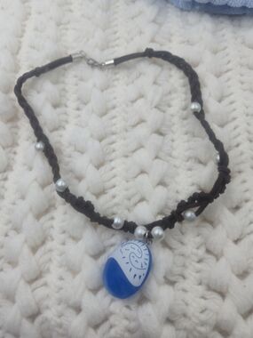 Moana-inspired necklace features a blue "Heart of Te Fiti" pen